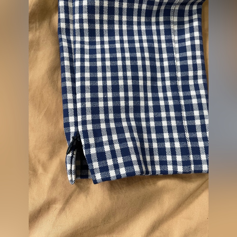 Blue and white checkered pants with slight leg zippers, very stretchy